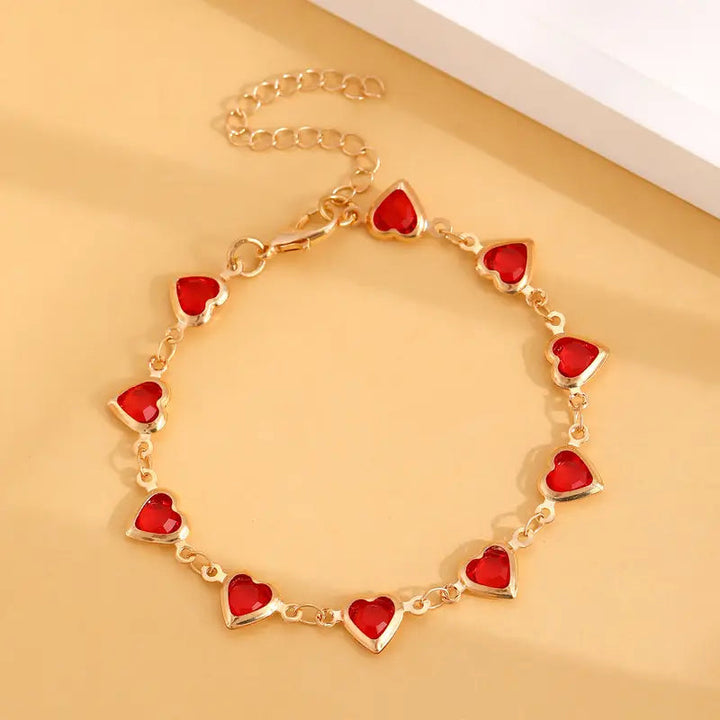 Pulsera en corazón de rubí dorado