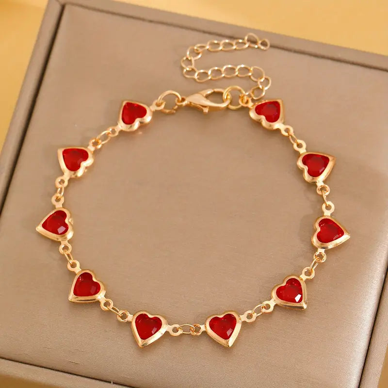 Pulsera en corazón de rubí dorado