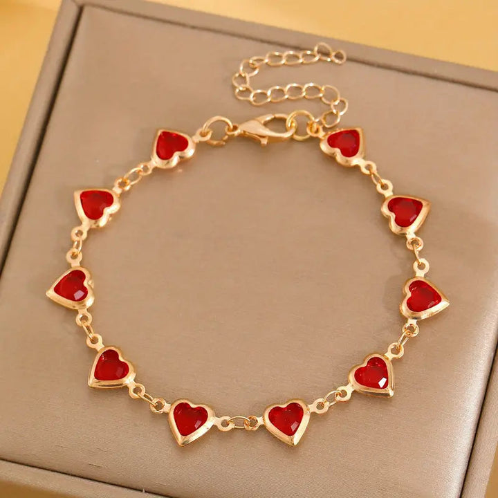 Pulsera en corazón de rubí dorado