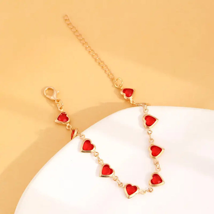 Pulsera en corazón de rubí dorado