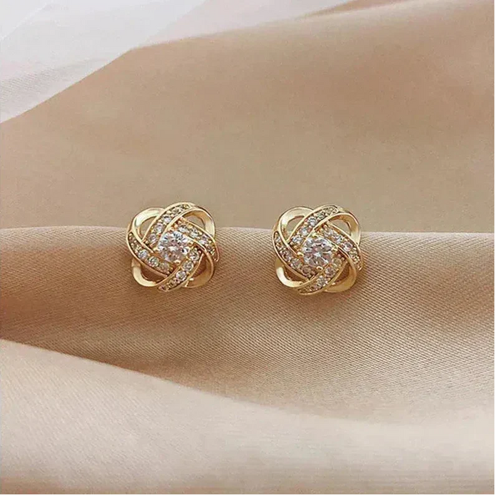 Pendientes en espiral dorados con cristales