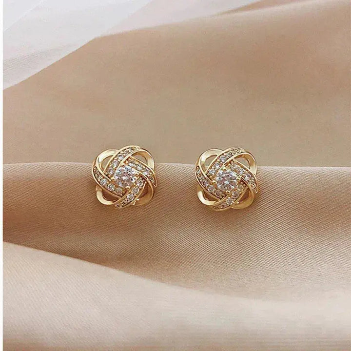 Pendientes en espiral dorados con cristales