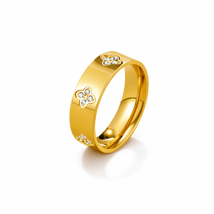 Anillo de trébol dorado con cristales