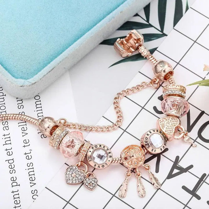 Pulsera Atrapa-Sueños Rosa con Charms de Plata Incluidos