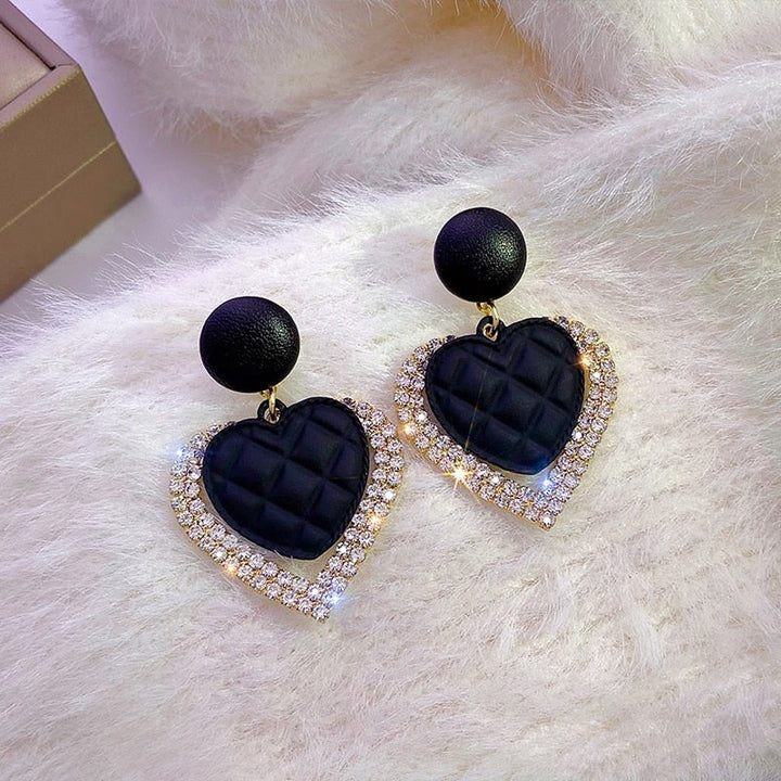 Pendientes en forma de corazón negros de oro