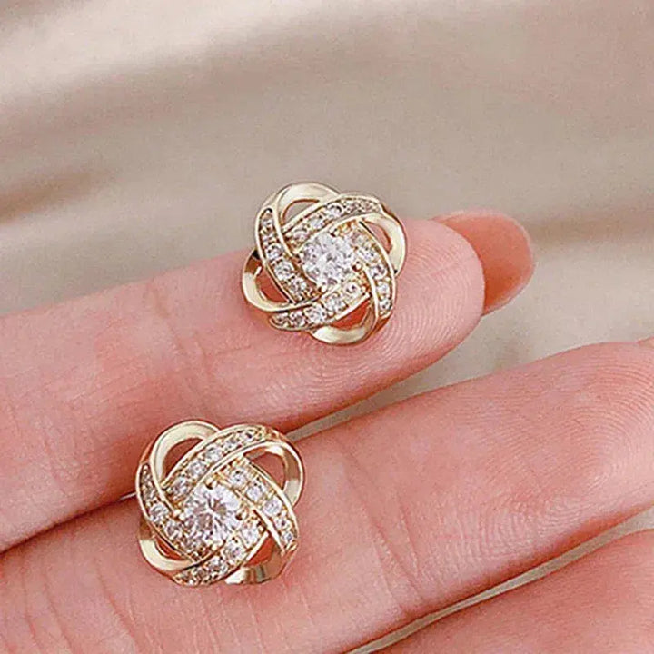 Pendientes en espiral dorados con cristales