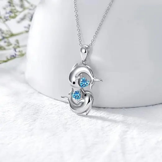 Collar de Plata con Delfines Dobles y Cristal Azul