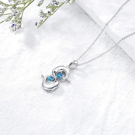 Collar de Plata con Delfines Dobles y Cristal Azul