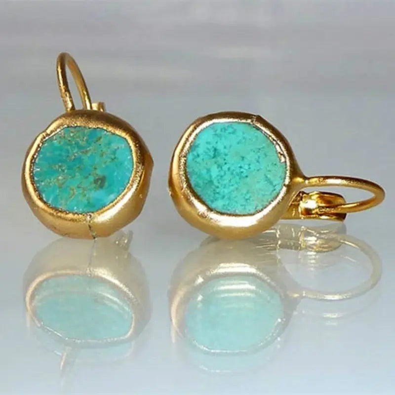 Pendientes elegantes de oro con piedra turquesa