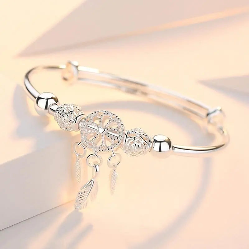 Pulsera con colgante atrapa-sueños de plata