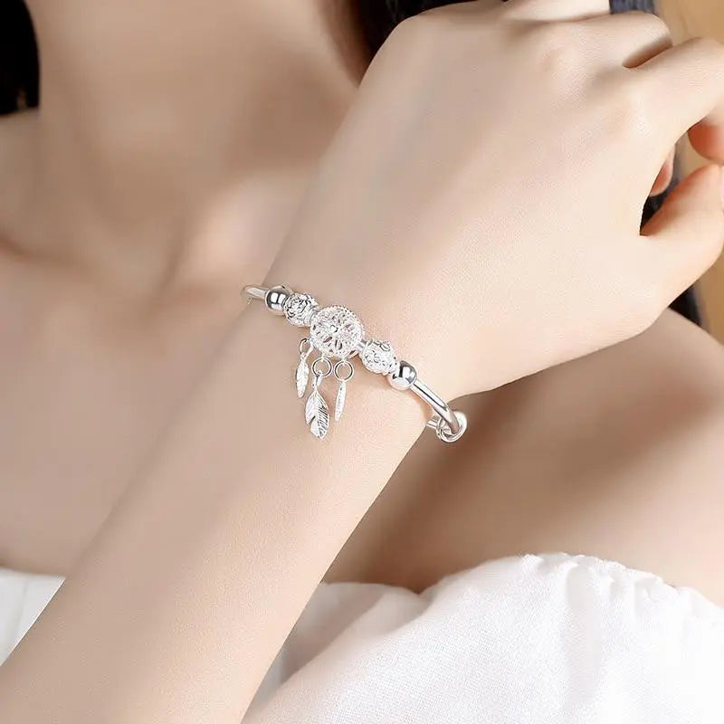 Pulsera con colgante atrapa-sueños de plata