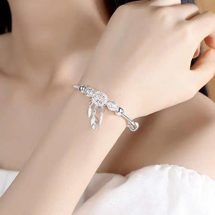 Pulsera con colgante atrapa-sueños de plata